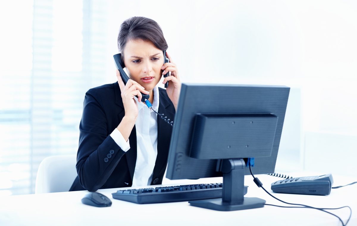 An answering service operator taking a call